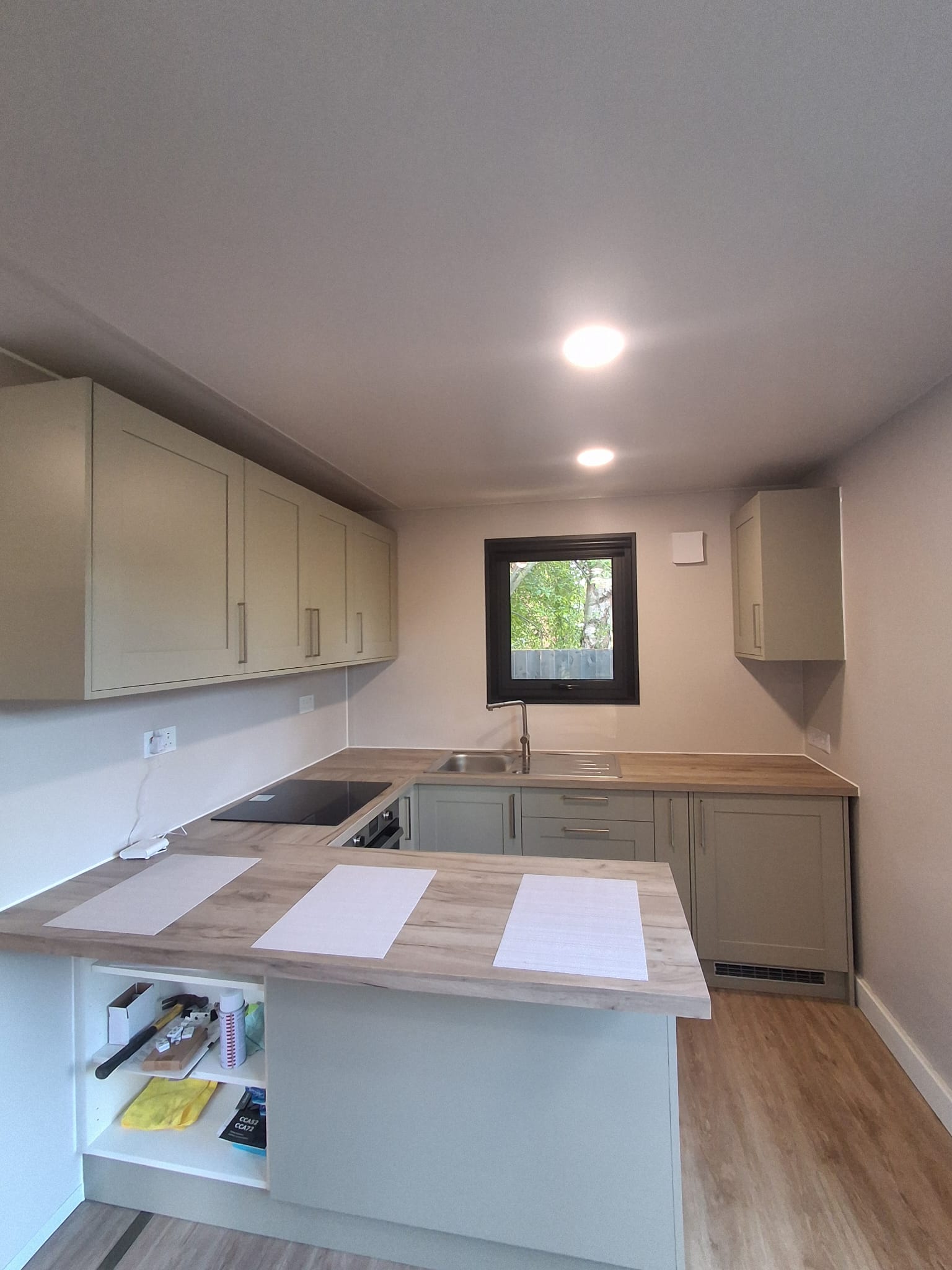 Bright finished kitchen and living area inside a recently installed PrefabX modular home